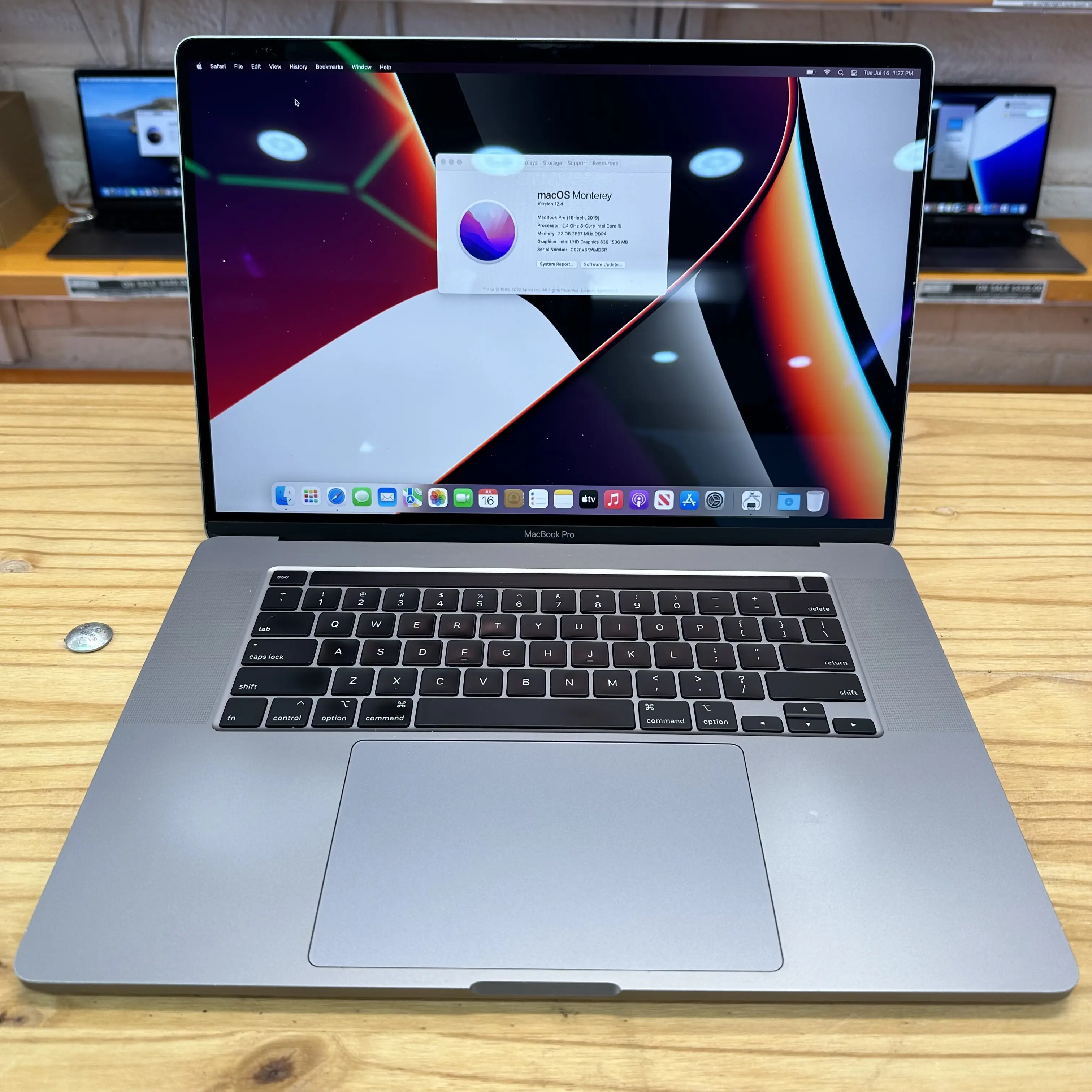 a-front-on-view-of-a-certified-refurbished-apple-macbook-pro-16-inch-a2141-in-space-gray-open-and-displaying-the-screen-keyboard-and-touch-bar