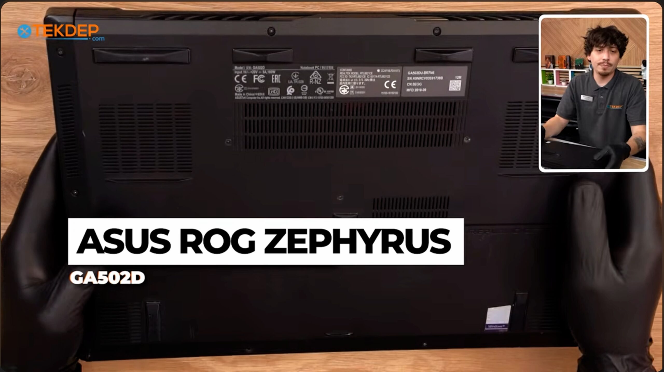 ASUS ROG Zephyrus GA502D full teardown: the laptop open on the repair bench ready for disassembly.