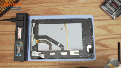 Samsung Galaxy Tab S7 screen replacement: the old cracked glass is peeled away from the tablet body.
